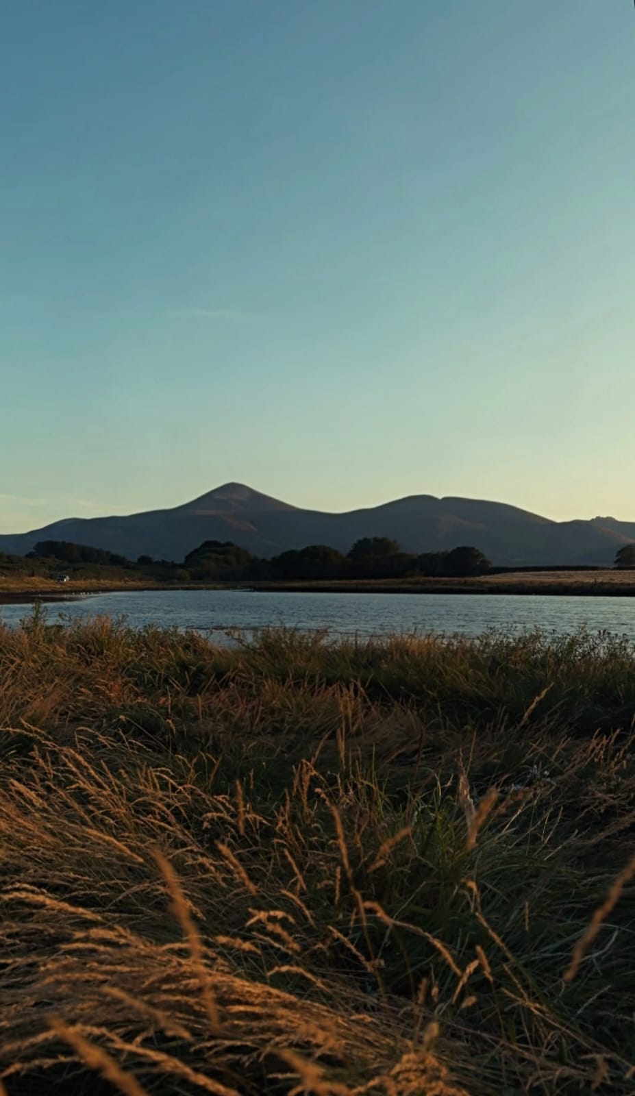 The Mourne Mountains at sunset, seen across the water from Newcastle